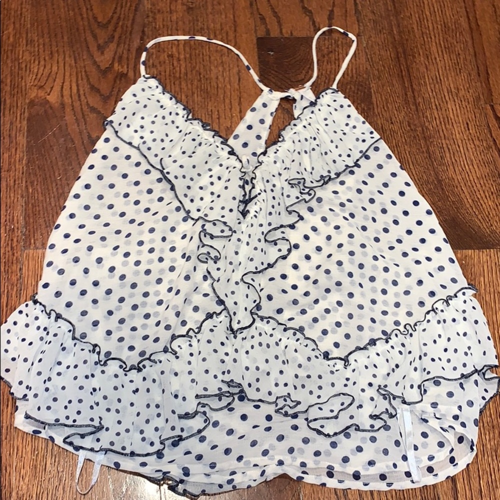 A blue and white polka dot tank